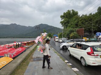 Dark clouds hang over Dal Lake after rain, thunderstorms and gusty winds swept parts of Srinagar