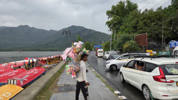 Dark clouds hang over Dal Lake after rain, thunderstorms and gusty winds swept parts of Srinagar